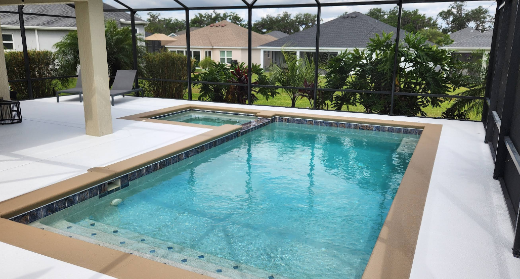 Modern home entrance with white painted concrete walkway and light gray epoxy garage floor coating